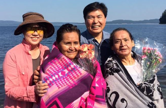 Rev. Joey Cho with his wife Insook Han and two newly-baptized members of the Stz'uminus First Nation